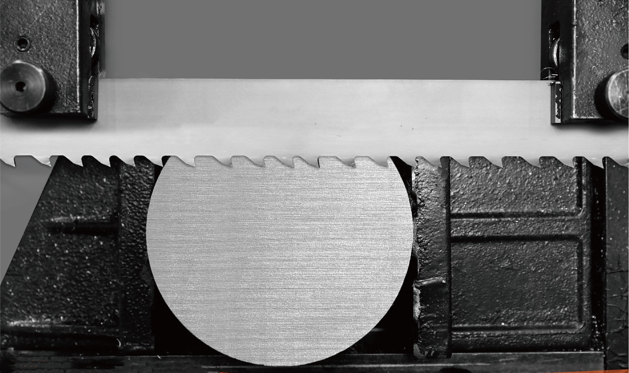 Cutting Rebar with Carbide Blades Bundle of steel rebar being cut by a band saw