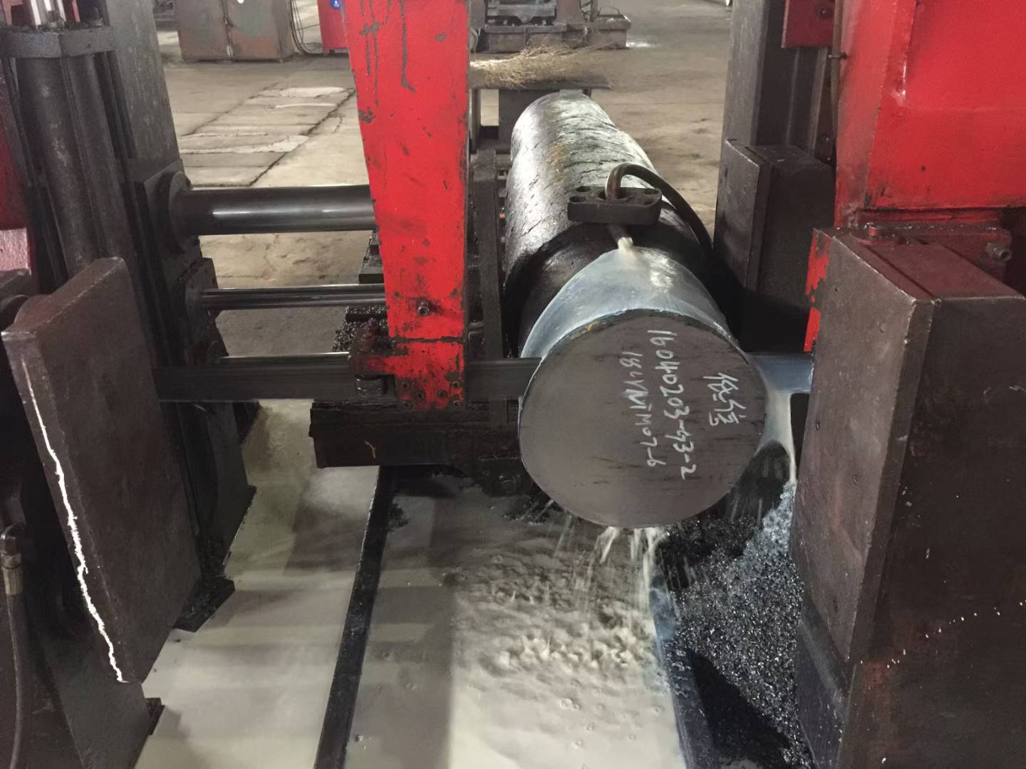 Greasing a bearing on a band saw machine