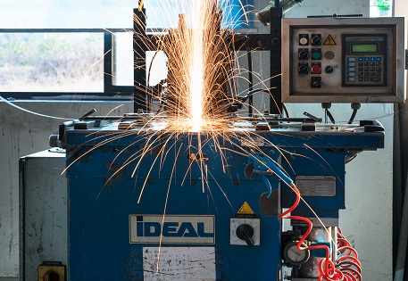 Close-up inspection of a band saw blade's teeth