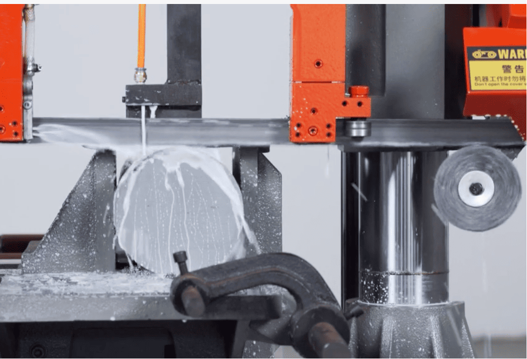 band saw coolant coolant flooding a band saw blade as it cuts metal