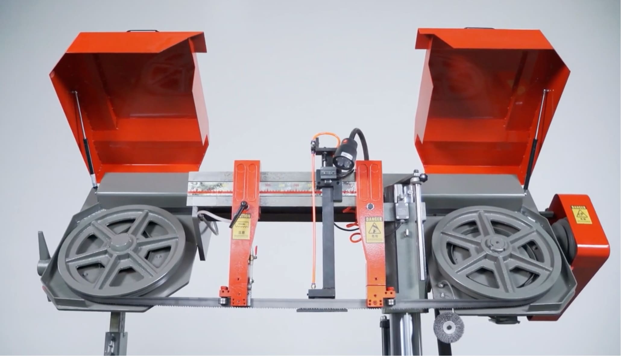 A new band saw blade being installed on a machine